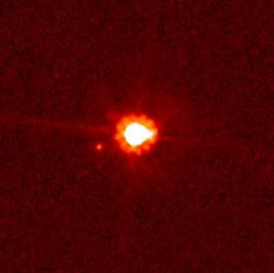 Eris (center) and Dysnomia (left); image taken by the Hubble Space Telescope