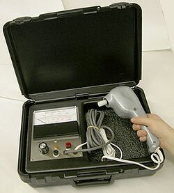 An analog biothesiometer kit held by hand