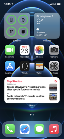 iOS 14 home screen showing the Battery, Weather and News widgets placed among the app icons