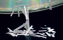 File:Paper shavings attracted by charged cd.jpg
