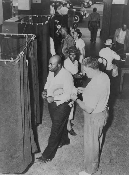 File:Voters at the voting booths in 1945.jpg