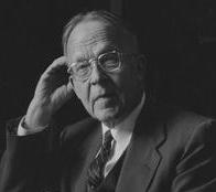 Henry Joel Cadbury sitting at a desk photo from AFSC archive.jpg
