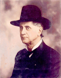 A faded photograph of William G. Steel, founder of The Mazamas climbing club named after the volcano, who is seated and wearing a hat