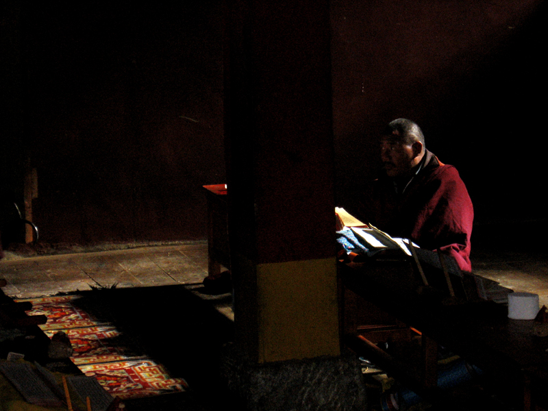 File:Tibetan Buddhist Monk in natural light reading sacred texts in 2006.jpg