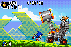 Gameplay screenshot showing Sonic fighting the EggHammerTankII, the first of the game's several auto-scrolling bosses.
