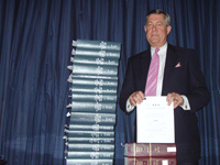 U.S. Rep. John Linder with the 2007 Tax code and complete set of Title 26 of the US Code of Federal Regulations.jpg