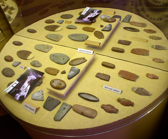 File:Poverty Point gorgets atlatl weights HRoe 2009.jpg