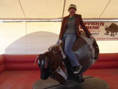 File:Woman riding mechanical bull.jpg