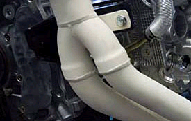 File:Plasma sprayed ceramic coating applied onto a part of an automotive exhaust system copy.jpg