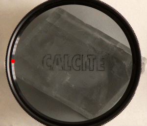 File:Calcite and polarizing filter.gif