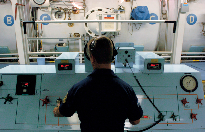 File:Diving instructor controls compression chamber.jpg