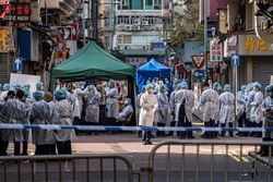 Jordan, Hong Kong healthcare workers testing residents for COVID-19.jpg