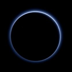 Blue hazes over backlit Pluto.jpg