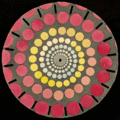 A circular disk with colourful spots for swirling to see a moving image.