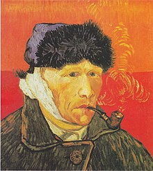 Portrait of a clean shaven man wearing a furry winter hat and smoking a pipe, facing to the right with a bandaged right ear