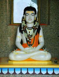 Sculpture of a young yogi sitting in the lotus position
