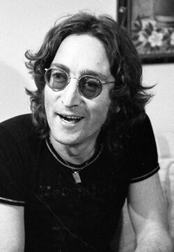 A black and white picture of John Lennon in his mid-thirties