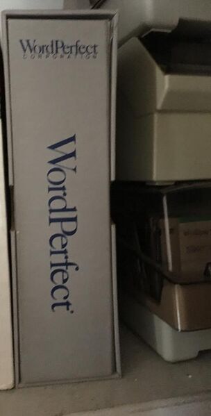 File:WordPerfect for DOS box alongside 3.5 inch diskette holders.jpg