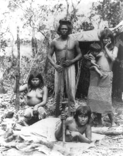 Indian family in Brazil posed in front of hut.jpg