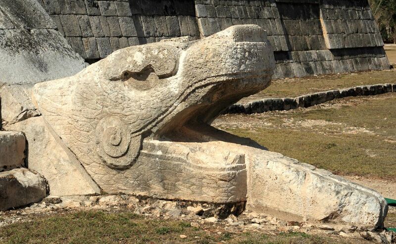 File:Serpent head at the base of El Castillo.jpg