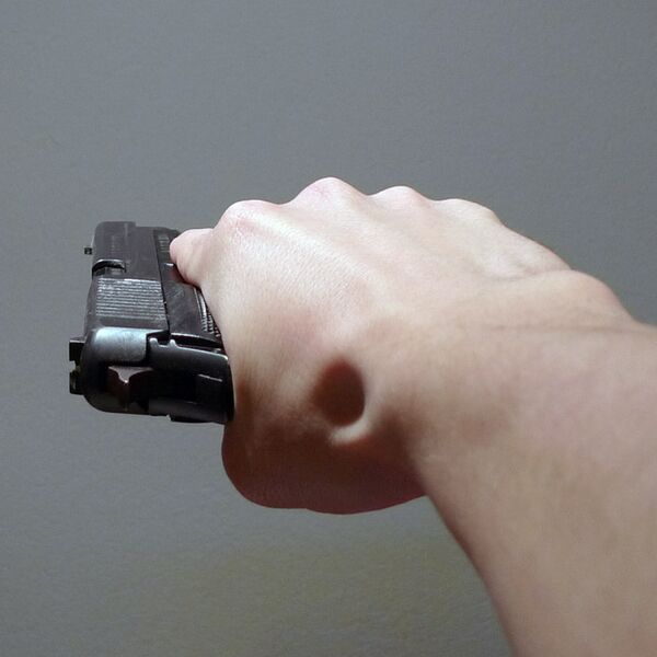 File:Pistol held sideways.jpg