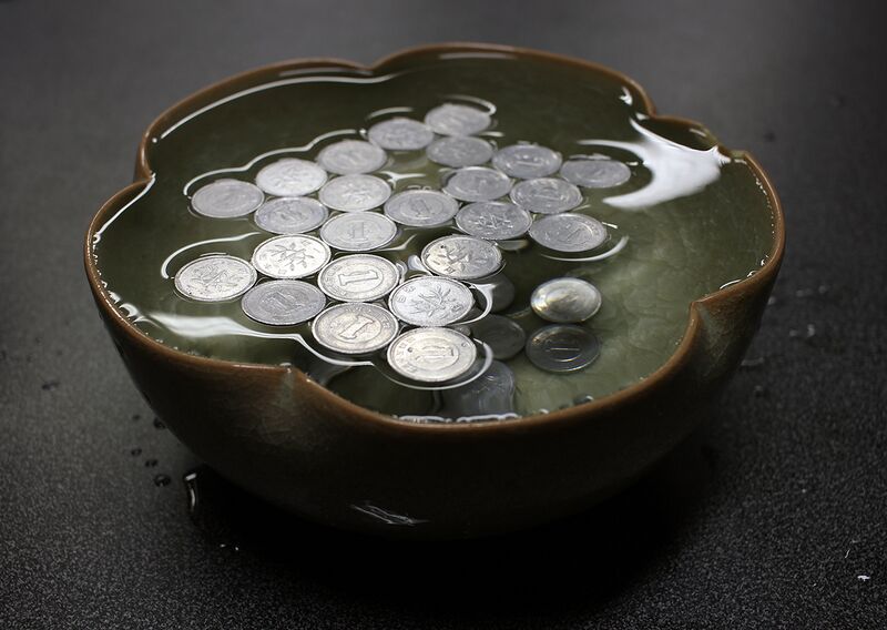 File:Surface tension with coins.JPG