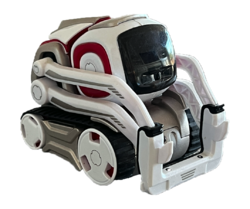 A small, white and gray robot with red highlights and a square black face