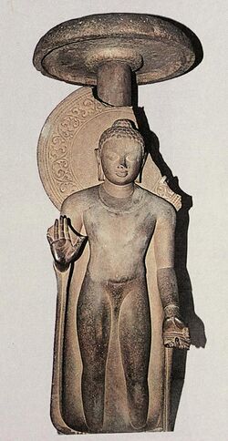 Buddha, standing under umbrella, inscribed Gift of Abhayamira in 154 GE 474 CE in the reign of Kumaragupta II.jpg