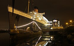 The Queen Mary with the Soviet submarine B-427, since closed to the public, at night