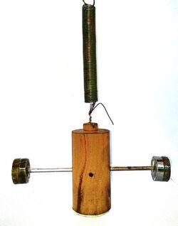 Wilberforce pendulum with wooden central mass.