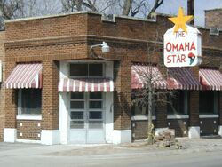 Brick Building with Omaha Star sign.