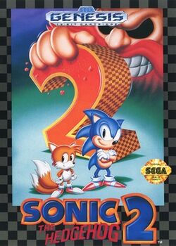 Sonic (an anthropomorphic blue hedgehog, right) and Tails (an anthropomorphic fox, left) stand confidently in front of a massive, checkered "2". A giant hand grips the top of the "2" on the left, and the face of Doctor Robotnik, a scowling, mustached mad scientist, looms in the background. Below Sonic and Tails, the words "Sonic the Hedgehog 2" sit. A black-and-gray checkered border surrounds the illustration, and Sega's seal of quality sits on Sonic's right.