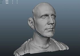 A digital rendering of a man's face in a motion capture software.