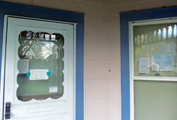 Notices on door and windows of foreclosed house, Walden, NY, April 2013.jpg
