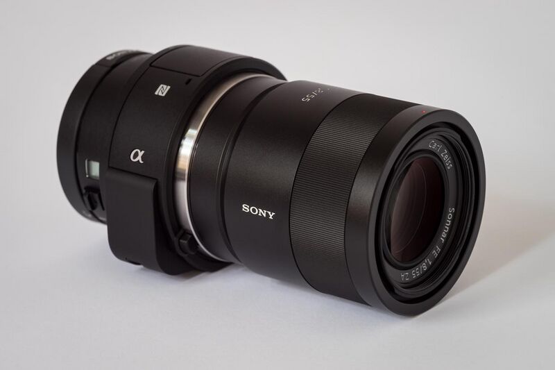 File:Sony Alpha ILCE-QX1 APS-C-frame camera with lens.jpeg