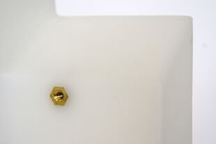 A brass threaded hex insert can be molded into plastic parts.