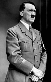 Formal photo of a standing Hitler