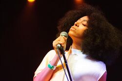 Solange Knowles onstage at a microphone