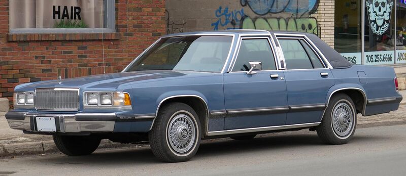 File:1989 Mercury Grand Marquis GS Sedan in Crystal Blue Clearcoat Metallic, Front Left, 11-27-2022.jpg