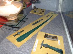 Mycenaean sword and Wietenberg culture axes at National Museum of Transylvanian History 2007.jpg