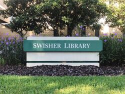 Swisher Library entrance sign