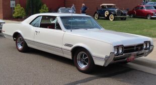 1966 Oldsmobile 4-4-2, front right (Cruisin' the River Lowellville Car Show, June 19th, 2023).jpg