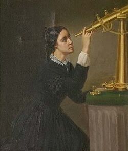 Woman looking up into a golden telescope, which is standing on a pedestal. She is wearing a black dress with long sleeves.