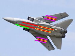 Underside view of jet fighter with colourful lines superimposed on the aircraft, showing under-wing and under-fuselage hardpoints