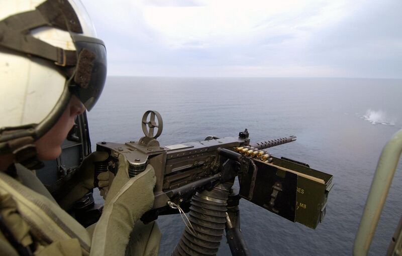 File:US Navy 040424-N-5319A-003 Aviation Warfare Systems Operator 2nd Class Patrick J.P. Neeley, from Plainfield, Ind., fires a .50 cal machine gun out of an SH-60B helicopter.jpg