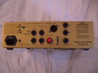 The rear panel of an amplifier unit is shown. Various jacks for plugging inputs and outputs are provided.