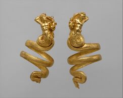 A pair of gold armbands, with a triton and tritoness respectively.