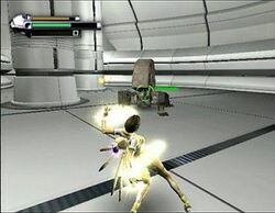 A horizontally rectangular video game screenshot with a digital representation of a space station. A woman in a glowing yellow outfit faces a grey robot at the center of the screen.
