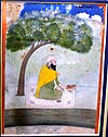 Miniature painting of Guru Ram Das seated outdoors on carpet underneath a tree with a book before him.jpg