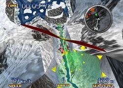 The screenshot shows a character in a red hang glider descending along an icy river between two snow-covered mountains. Green rings made up of yellow triangles accent the desired path. A radar is displayed at the top right. The character's time is on the top left. The character's speed, number of available photographs, and altitude are displayed at the bottom.